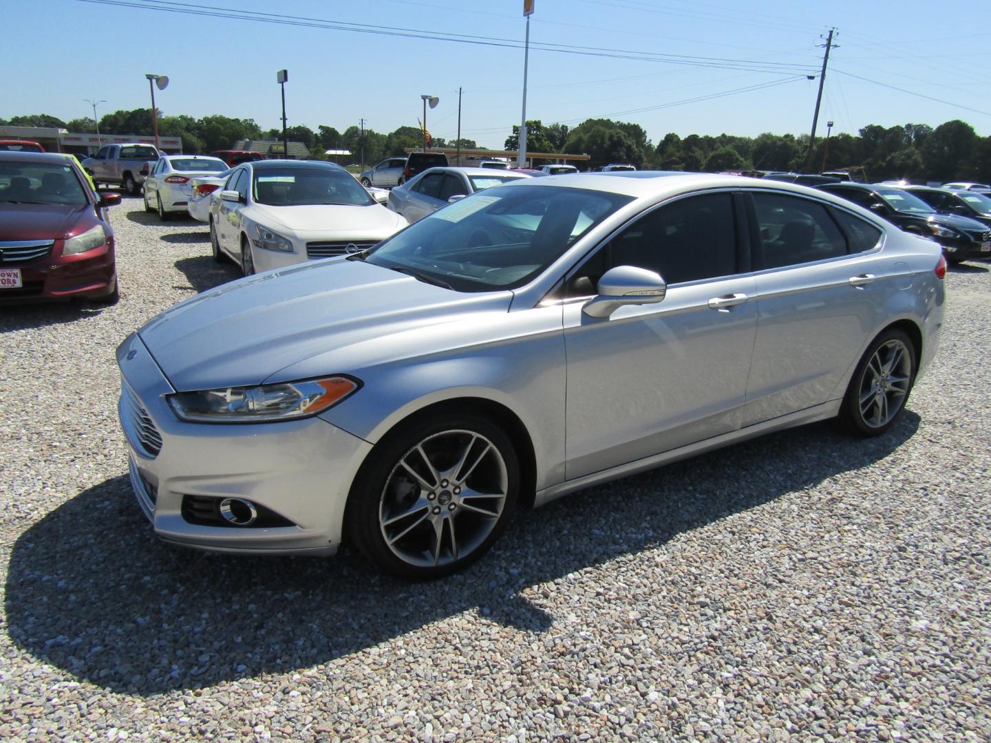 2016 Silver Ford Fusion Titanium (3FA6P0K96GR) with an 2.0L L4 DOHC 16V engine, Automatic transmission, located at 15016 S Hwy 231, Midland City, AL, 36350, (334) 983-3001, 31.306210, -85.495277 - Photo#2